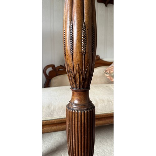 760 - A mahogany standard lamp on tripod base with reeded and wheatsheaf decoration. 173cm h to top of fit... 