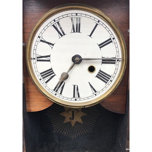 1037 - An oak mantle clock by J Unghans face with roman numerals