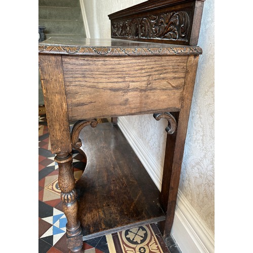6 - A 19thC carved oak hall table with two drawers to front and raised upstand to back. 106 w x 91 h x 4... 
