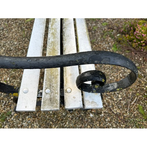 187 - A cast iron and wooden bench. 183.5 l x 62 d x 77cm h.