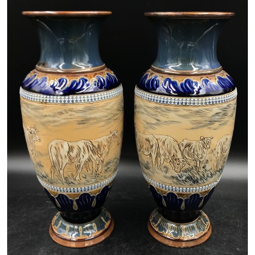 330 - A pair of Doulton Lambeth Stoneware vases by Hannah Barlow one decorated with horse, cattle and hayc... 