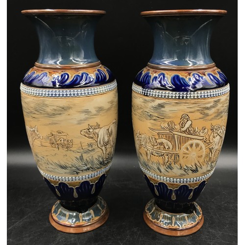 330 - A pair of Doulton Lambeth Stoneware vases by Hannah Barlow one decorated with horse, cattle and hayc... 