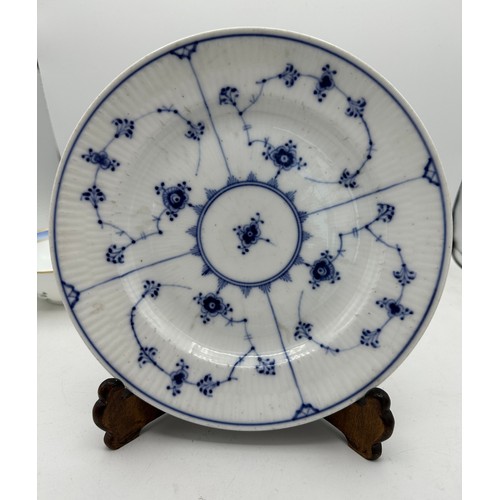 331 - Royal Copenhagen to include a plate 22.5cm , 3 x soup bowls with 4 stands and a shallow dish.