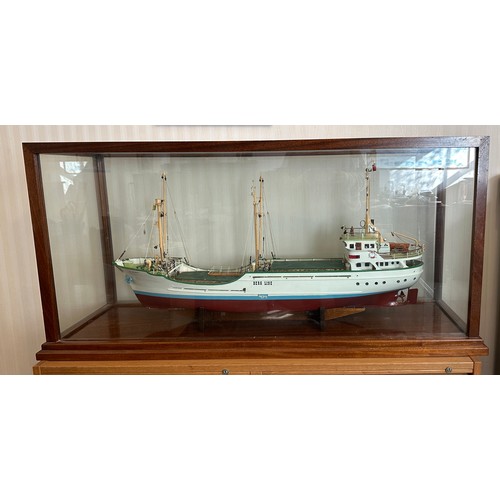 1215 - Model of Berg Line ship, J Scott, Goole in mahogany and glass. 59h x 121 w x 38cm d.