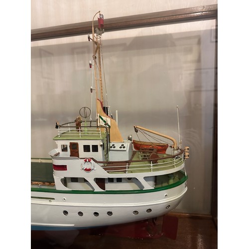 1215 - Model of Berg Line ship, J Scott, Goole in mahogany and glass. 59h x 121 w x 38cm d.