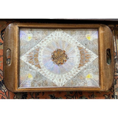 1216 - Two hardwood trays, one carved and one inlaid with butterfly wings. Largest 64 x 41cm without handle... 