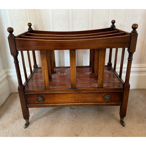 132 - A 20thC mahogany canterbury with drawer to base and brass castors. 53 h x 56 w x 36cm d.