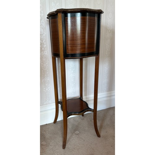 133 - An Edwardian mahogany and inlaid jardinière. 98cm h.