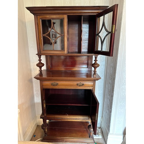 135 - An Edwardian mahogany cabinet, cupboard and single drawer to base, glazed doors to top with 4 compar... 