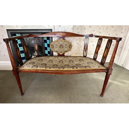 137 - An Edwardian two seater upholstered sofa with Mother of Pearl inlay.