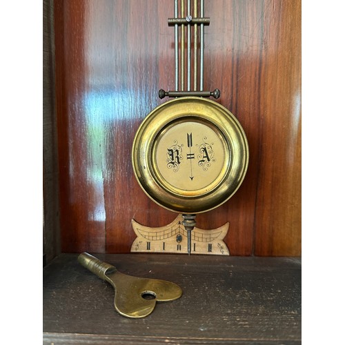 1040 - A mahogany wall clock with white enamel dial. 88 h x 37cm w approx.