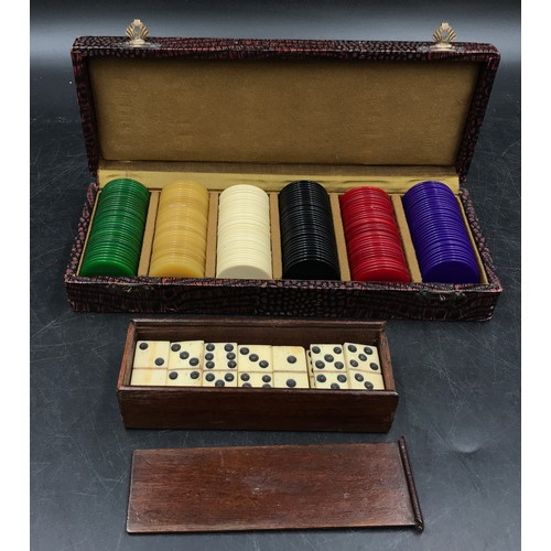 1224 - A complete boxed set of bone dominoes along with a boxed set of poker chips comprising of 34 green, ... 