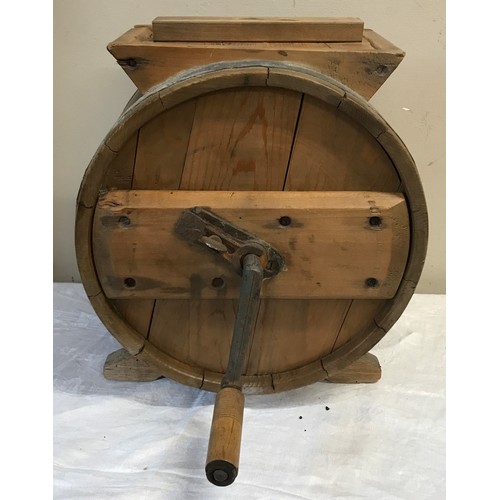 1228 - A 20thC wood and metal bound butter churn in shape of a barrel with winding handle stamped with R.C.... 