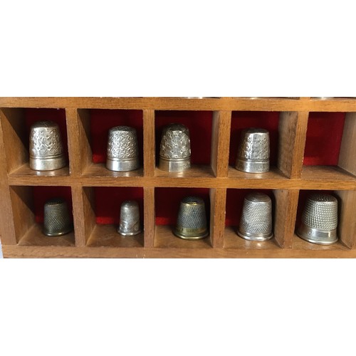 856 - A case holding 18 silver thimbles (first 4 rows) various hallmarks some saying sterling silver and 9... 