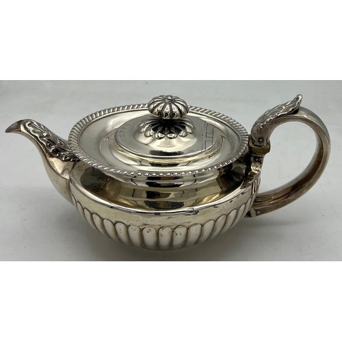 859 - A silver teapot London 1825, maker probably James Wintle. Weight 499.5gm.