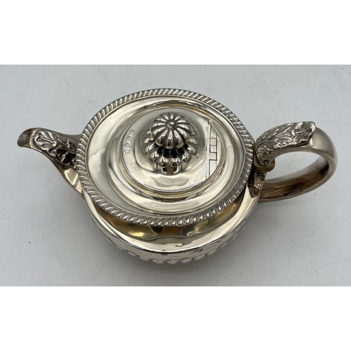 859 - A silver teapot London 1825, maker probably James Wintle. Weight 499.5gm.