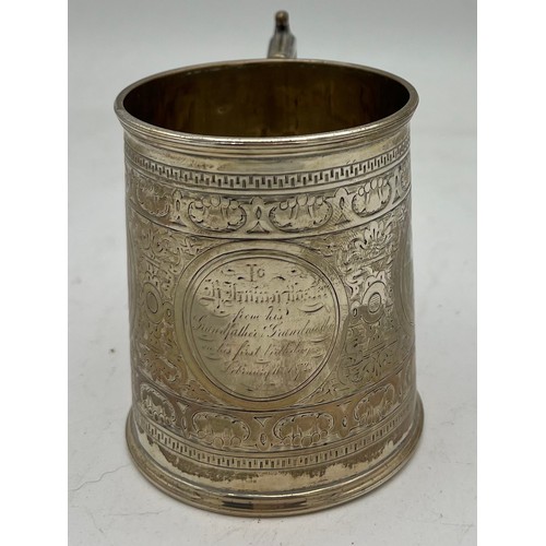 860 - Silver tankard, Sheffield 1868, makers marked rubbed. Weight 134.9gm.