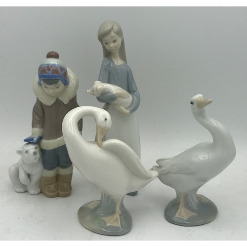 340 - A collection of ceramic figures to include four Lladro: Eskimo Boy With Pet, Girl with pig and two d... 