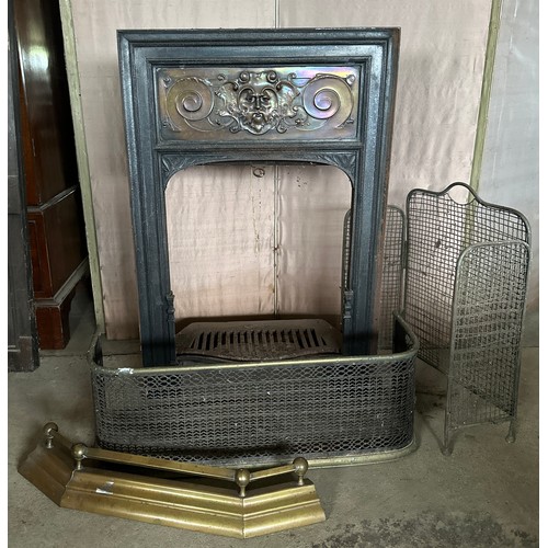 1241 - A cast iron and copper fire insert 92cm h x 61.5 w x 27 d together with brass and metal fire guards ... 