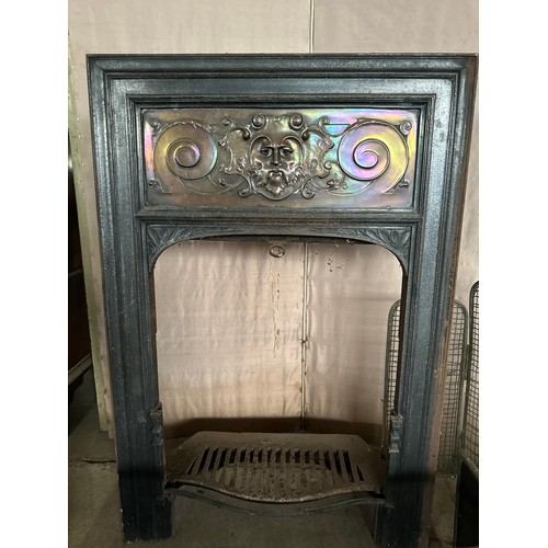 1241 - A cast iron and copper fire insert 92cm h x 61.5 w x 27 d together with brass and metal fire guards ... 