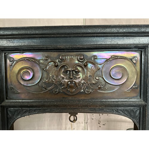 1241 - A cast iron and copper fire insert 92cm h x 61.5 w x 27 d together with brass and metal fire guards ... 