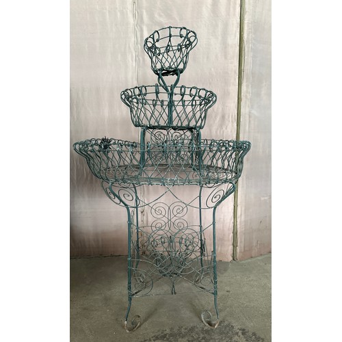 189 - A vintage wire work plant display stand with three tiers. 109cm h x 66cm w.