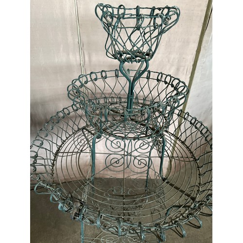 189 - A vintage wire work plant display stand with three tiers. 109cm h x 66cm w.