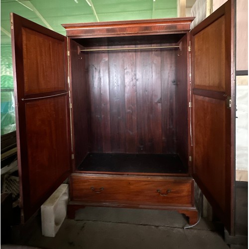 151 - An Edwardian mahogany wardrobe with drawer to base, bracket feet, brass rail and hooks to interior. ... 