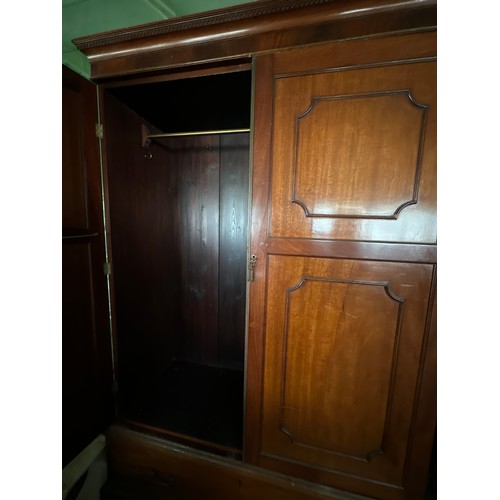 151 - An Edwardian mahogany wardrobe with drawer to base, bracket feet, brass rail and hooks to interior. ... 