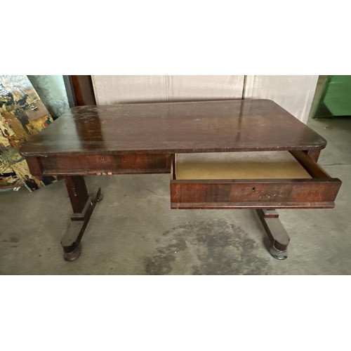 152 - A 19thC rosewood library table with single drawer to each side and concealed castors. 128cm l x 66 d... 