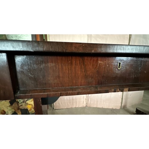 152 - A 19thC rosewood library table with single drawer to each side and concealed castors. 128cm l x 66 d... 