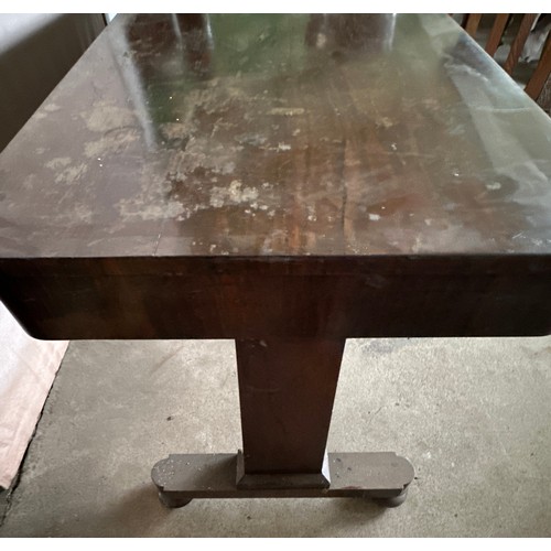 152 - A 19thC rosewood library table with single drawer to each side and concealed castors. 128cm l x 66 d... 