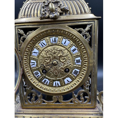 1042 - An ornate brass mantle clock 39cm h.