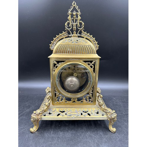 1042 - An ornate brass mantle clock 39cm h.