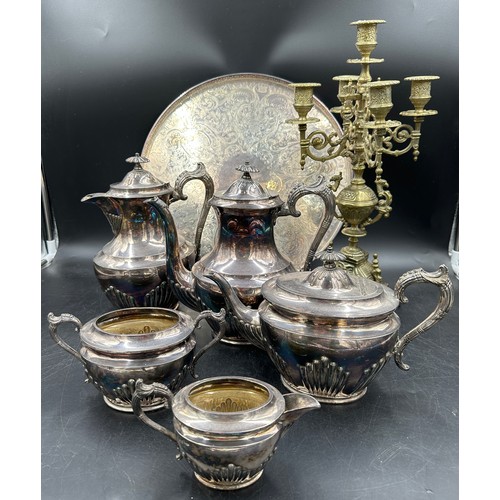 780 - A silverplated tea and coffee set with unassociated tray and a brass four branch candelabra.