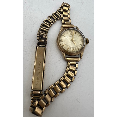 462 - A 9ct gold case ladies Tissot wristwatch with 9ct bracelet. Total weight 18gms.