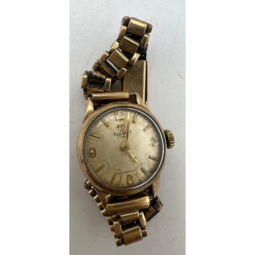 462 - A 9ct gold case ladies Tissot wristwatch with 9ct bracelet. Total weight 18gms.