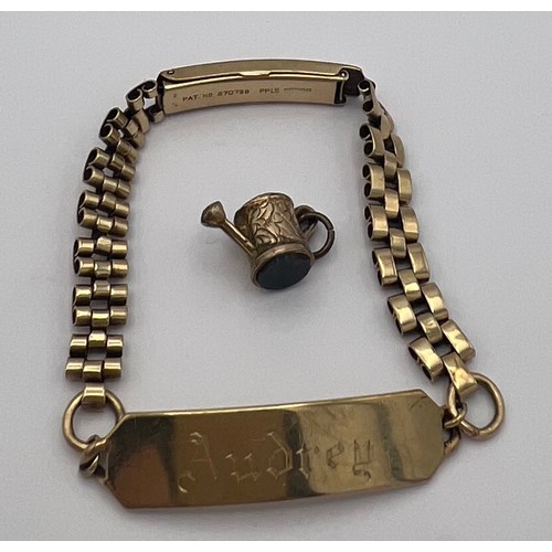 463 - A 9 carat gold identity bracelet together with an unmarked yellow metal watering can. Weight of brac... 