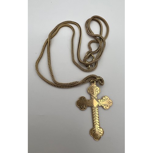 465 - A 9 carat gold chain and crucifix pendant. Total weight 6.7gm. Crucifix 3.5 x 2.2cm. Length of chain... 