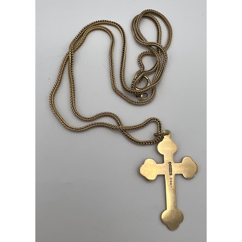 465 - A 9 carat gold chain and crucifix pendant. Total weight 6.7gm. Crucifix 3.5 x 2.2cm. Length of chain... 