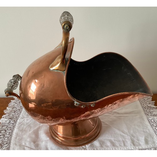 1247 - A 19thC copper coal helmet with glass handles. 50 x 28cm.