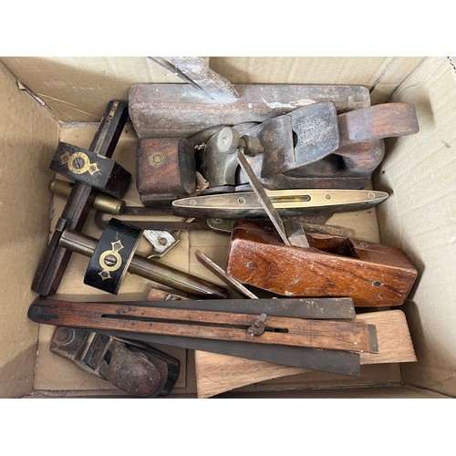 1251 - A boxed lot of various 19thC/20thC tools to include planes, levels etc.