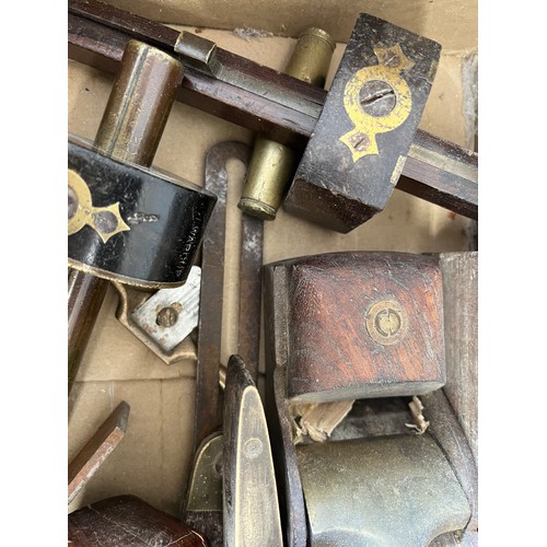 1251 - A boxed lot of various 19thC/20thC tools to include planes, levels etc.