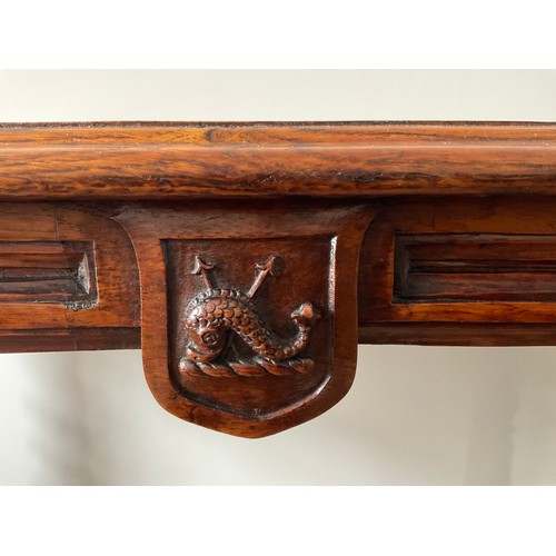 156 - A 19thC burr elm library table of exceptional quality with whale and harpoon carving and concealed c... 