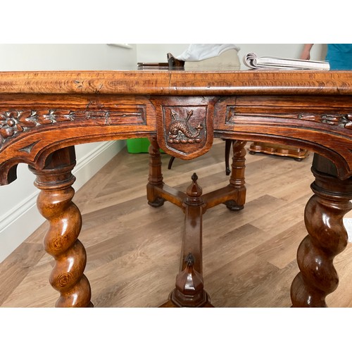 156 - A 19thC burr elm library table of exceptional quality with whale and harpoon carving and concealed c... 