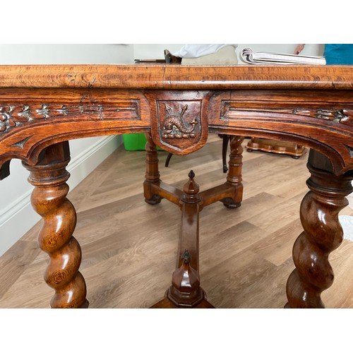 156 - A 19thC burr elm library table of exceptional quality with whale and harpoon carving and concealed c... 