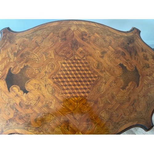 158 - A 19thC French marquetry inlaid centre table with ormolu mounts and drawer to one side. Inlaid with ... 