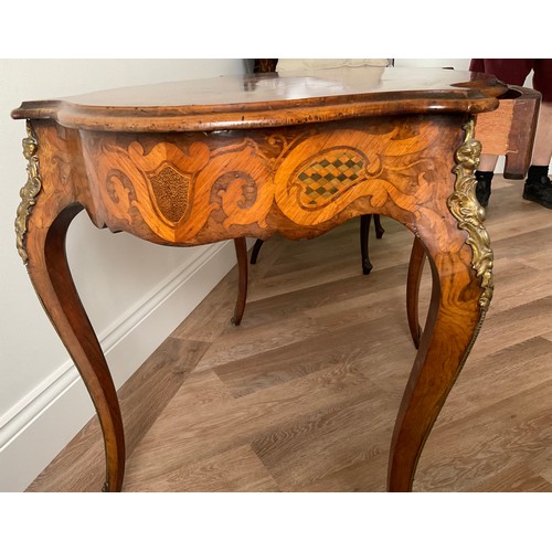 158 - A 19thC French marquetry inlaid centre table with ormolu mounts and drawer to one side. Inlaid with ... 