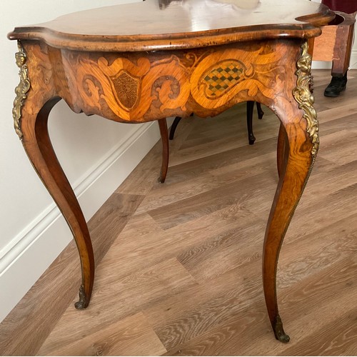 158 - A 19thC French marquetry inlaid centre table with ormolu mounts and drawer to one side. Inlaid with ... 