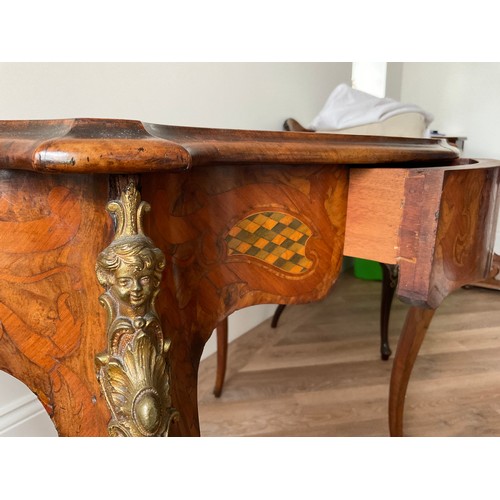 158 - A 19thC French marquetry inlaid centre table with ormolu mounts and drawer to one side. Inlaid with ... 